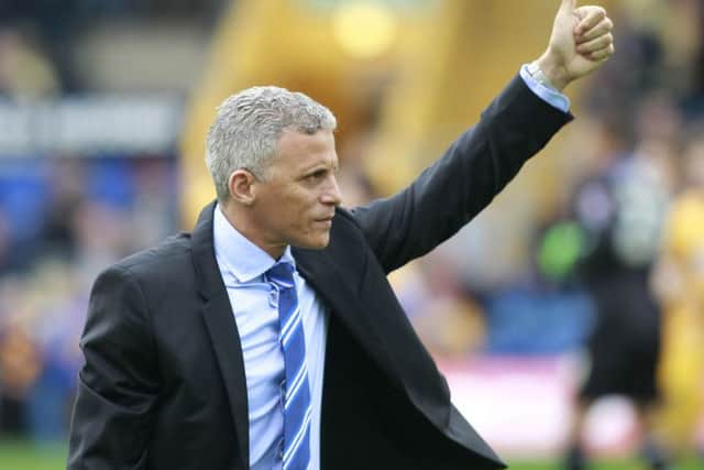 Ex-Mansfield Town boss Keith Curle gives a thumbs up to the home crowd after receiving a round of applause -Pic by: Richard Parkes