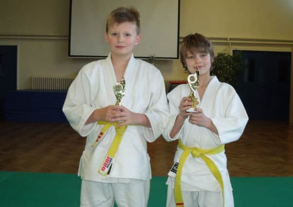 DOUBLE ACT -- gold medals for Edgewood Judo Club youngsters Conor Hendrick and Jack Elliott.
