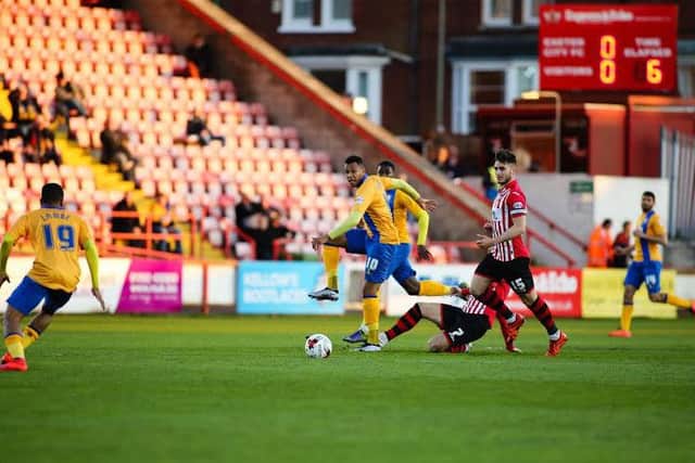 Mansfield Town's Matt Green looks to make the pass - Picture Chris Holloway