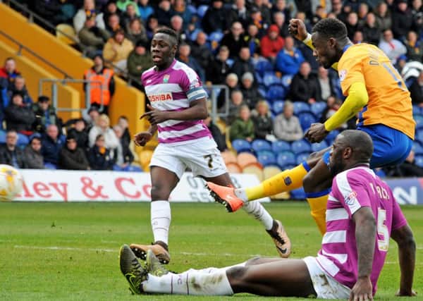 Mansfield Town v Barnet.
Dieseruvwe shoots to score Mansfield's equalizer.