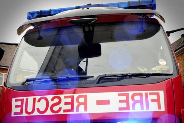 Firefighters were called to tackle a ghost train fire at the side of the road.