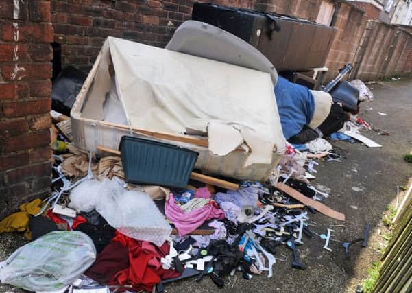 Fly-tipping mess to the rear of properties on Victoria Street, Mansfield, for which the Council  want the residents to pay for clear-up.