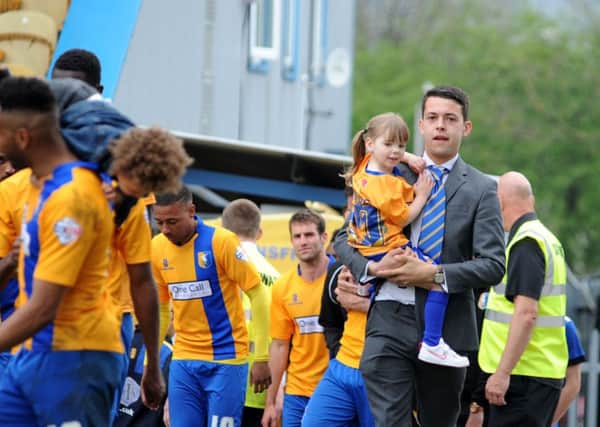 Mansfield Town v Cambridge Utd.
Fans and players celebrate the last game of the season at the One Call Stadium.