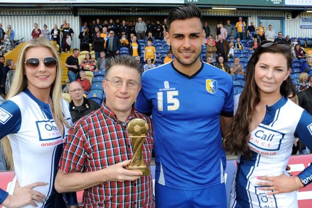 Sports Editor John Lomas hands over the Chad Readers' trophy to Ryan Tafazolli.