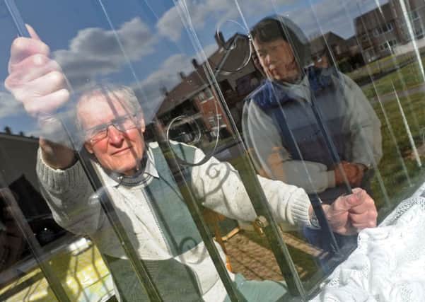 Dennis and Doris Buckley of Willow Crescent with the burglar bars that are on their Willow Crescent home.
