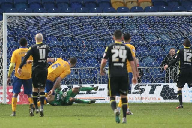 Mansfield Town 'keeper Scott Shearer saves the second penalty of the afteroon  - Pic by: Richard Parkes