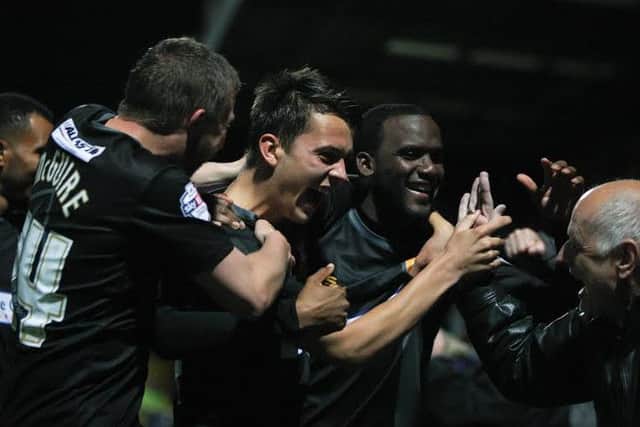 Jack Thomas celebrates his goal in the win at Stevenage.