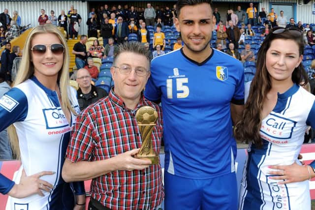 Sports Editor John Lomas hands over the Chad Readers' trophy to Ryan Tafazolli.