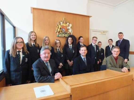 from left: Leah Cornish, Emily Hubbard, Molly Hall, Mya Brady, Hollie Whittle, Rebecca Norris, Tom Williams, Benjamin Rice and Dylan Hopkins, teacher Gavin Brookes 

Front row from left: Councillor Glynn Gilfoyle, Community Safety Chairman, at Nottinghamshire County Council, Tim Desmond, CEO Galleries of Justice Museum, Paul Bowden, Chairman of Trustees, National Centre for Citizenship and the Law.