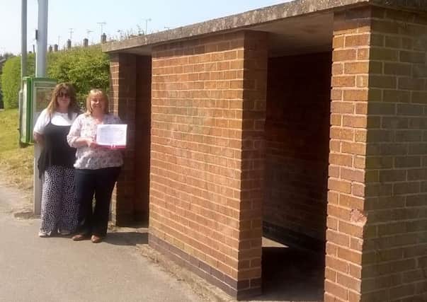 Pictured is Amander Rayment who is leading a campaign to have a brick built bus shelter on Kirklington Road replaced by a modern perspex one.