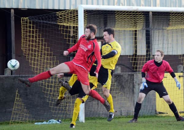 DERBY DAY -- action from a recent Hucknall Town v Linby Colliery Welfare derby at Watnall Road.