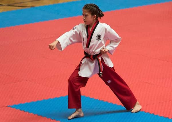ON TOP OF THE WORLD -- rising taekwondo talent Tahya Fells in action in Austria earlier this year.