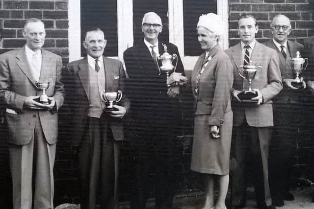 Ernest Sparks, right, with the Burton Cup, presented to him for his gardening skills at the former Council House on Watnall Road, Hucknall.