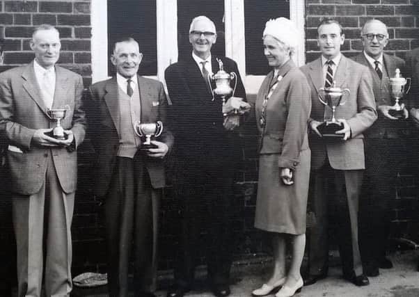 Ernest Sparks, right, with the Burton Cup, presented to him for his gardening skills at the former Council House on Watnall Road, Hucknall.