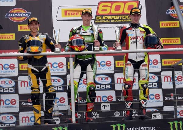 Taz Taylor, left, on the Brands Hatch podium at the weekend.