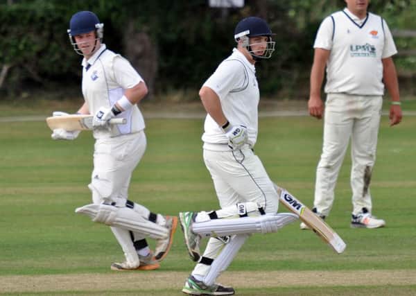 SCOURGE OF CUCKNEY -- Kimberley batsmen James Fenwick and Sam Johnson, who hit 87, pile on the runs to frustrate the title challenge of tabletopping Cuckney.