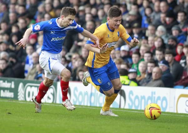 James Jennings skips past Pompey's Marcos Painter -Pic by: Richard Parkes