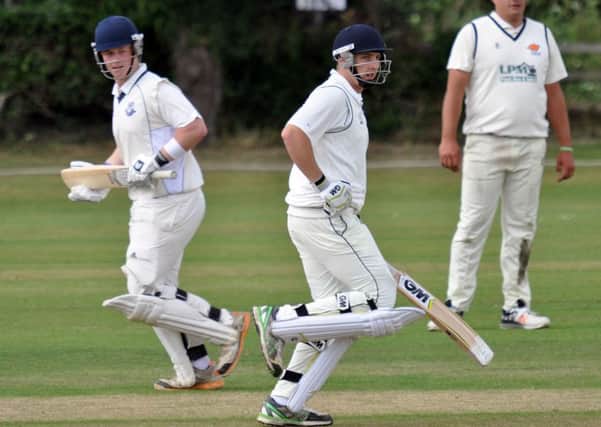 SCOURGE OF CUCKNEY -- Kimberley batsmen James Fenwick and Sam Johnson, who hit 87, pile on the runs to frustrate the title challenge of tabletopping Cuckney.