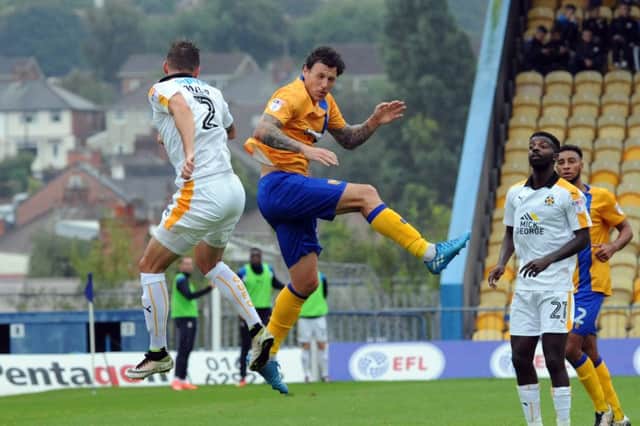Mansfield Town v Cambridge
Darius Henderson in aerial competition with Greg Taylor.