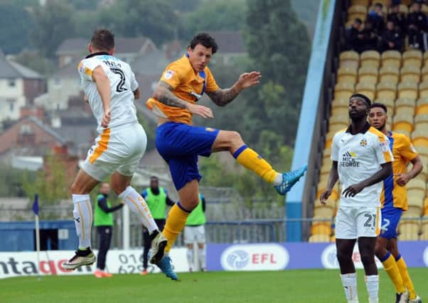 Mansfield Town v Cambridge
Darius Henderson in aerial competition with Greg Taylor.