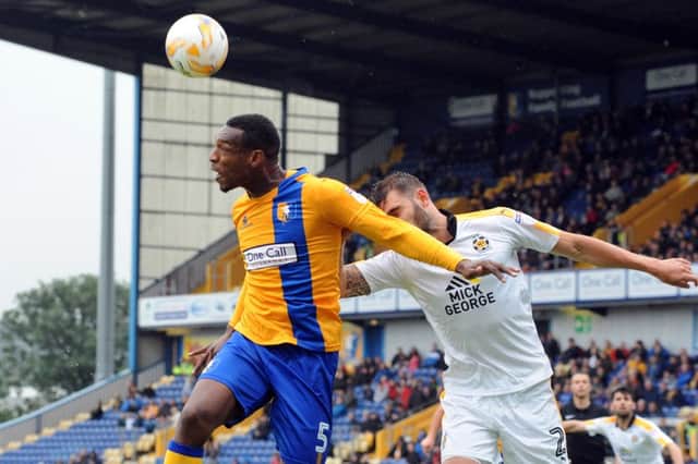 Mansfield Town v Cambridge
Krystian Pearce beats Greg Taylor to an edge of the box header.