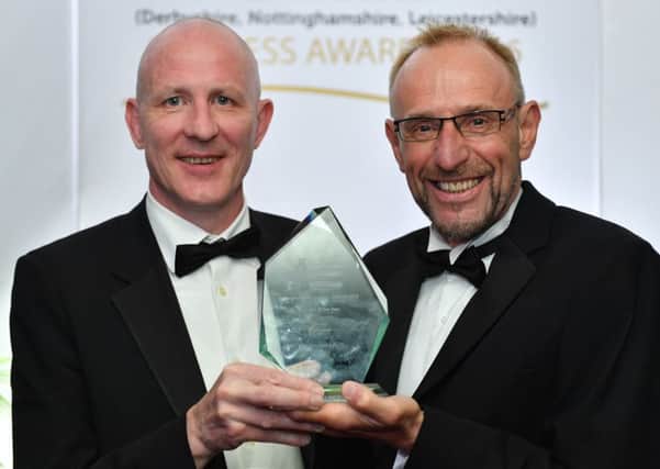 Chris Darlington, of Mazars, presents Andrew Buxton, of Stoneseed with his award