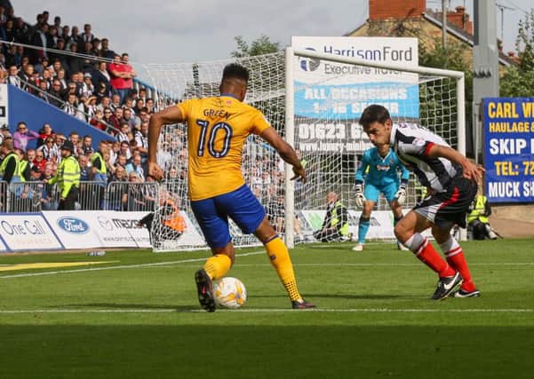 Mansfield Town's Matt Green heads for goal - Pic by Jeanette Holloway