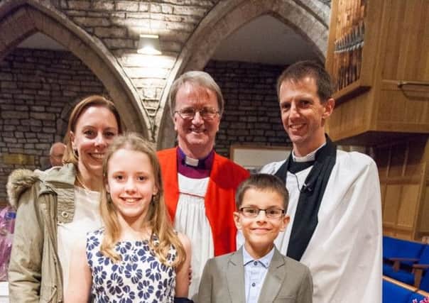 The Revd Trevor Raaffe (right) with his wife Carol, children Anna and Christopher and the Rt Revd Tony Porter (centre).