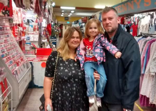 Brian and Michelle Garner from Sutton, with daughter Lois (3) at Sutton Indoor Market.
