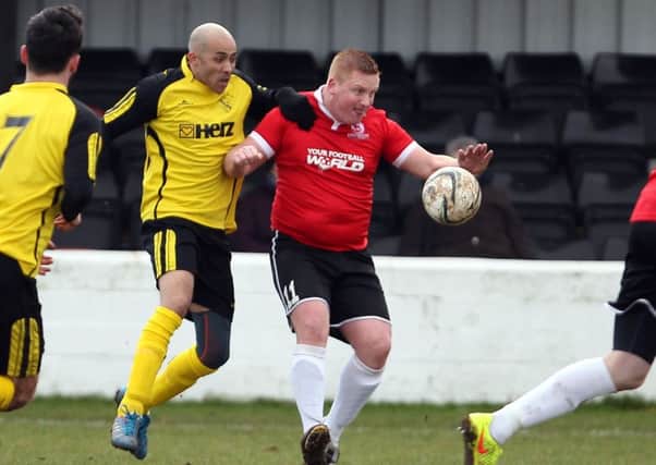 Adam Nelson (yellow) who was Hucknall's hero with the late winner, pictured in action earlier this year.

Pic by Dan Westwell