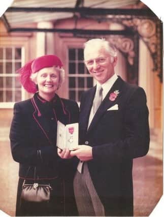 Dr Geoffrey Pearson with his wife, Janet, after being appointed MBE at Buckingham Palace in 1983.