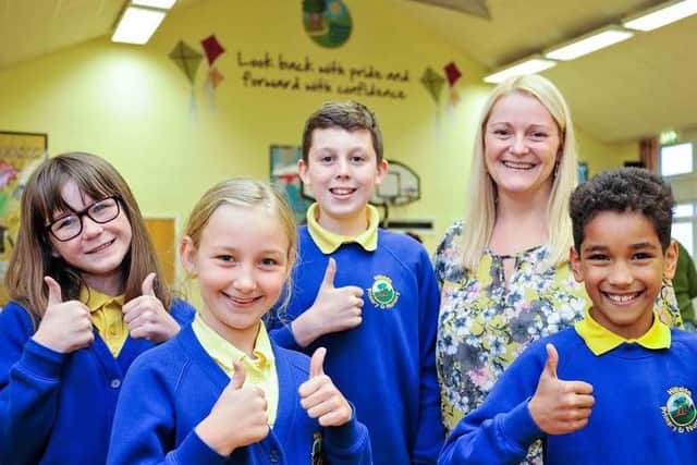 From left, Abigail Mould, Fern Hatcher, Max Dunn, Head Teacher Rhian Richardson and Elijah Oprych celebrate Hillside Primary School's "good" Ofsted report.