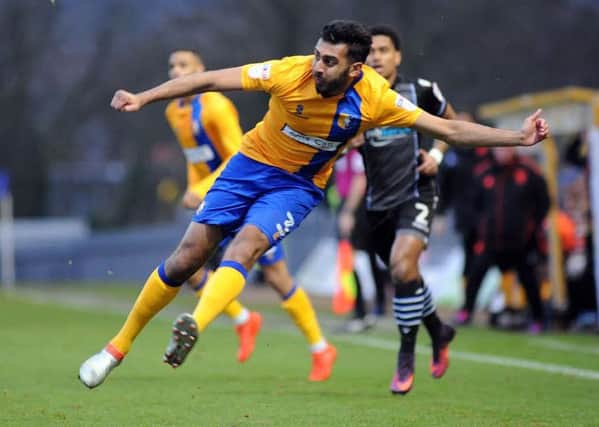 Mansfield Town v Colchester United.Mal Benning puts in a first half cross.