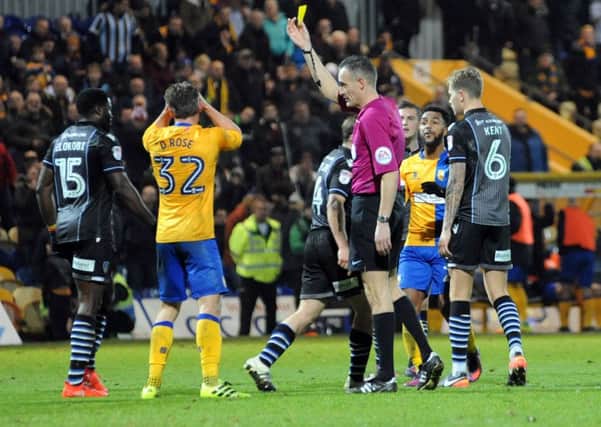 Mansfield Town v Colchester United.
Danny Rose is yellow carded for a dive in added time.
