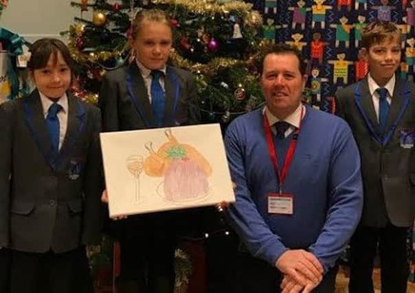 Sherwood MP Mark Spencer with the winners of his Christmas card competition