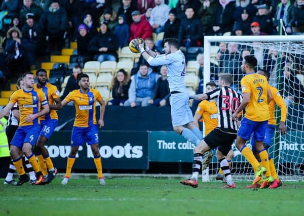 Mansfield Town's Jake Kean wins the ball - Pic by Chris Holloway