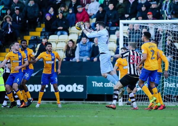 Mansfield Town's Jake Kean wins the ball - Pic by Chris Holloway