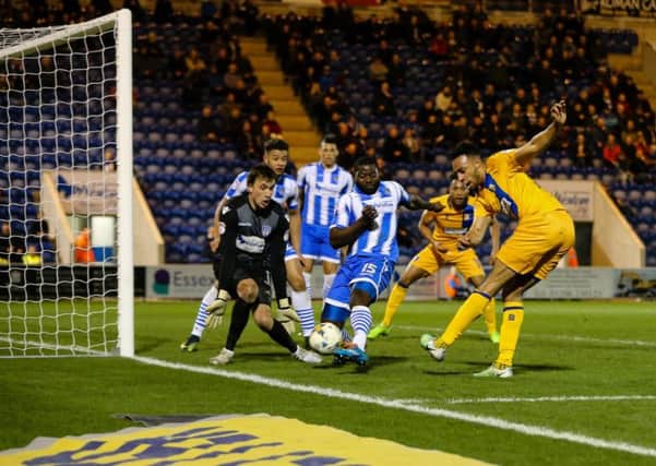 Mansfield Town's Rhys Bennett tries a shot on goal - Photo by Chris Holloway