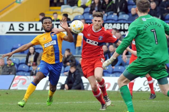 Mansfield Town v Carlisle United.
Shaquile Coulthirst puts pressure on the Carlisle defense.
