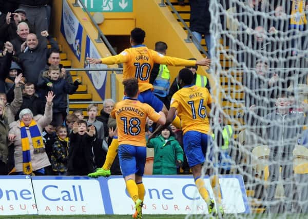 Mansfield Town v Carlisle United.
Matt Green rises to take the applause after putting Mansfield into the lead.