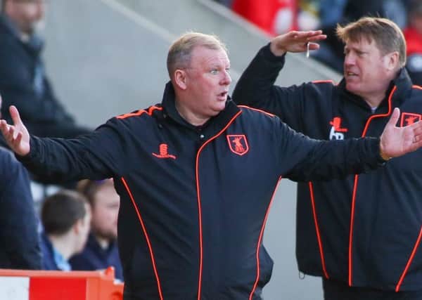 Mansfield Town's Manager Steve Evans with his assistant Paul Raynor - Photo by Chris Holloway