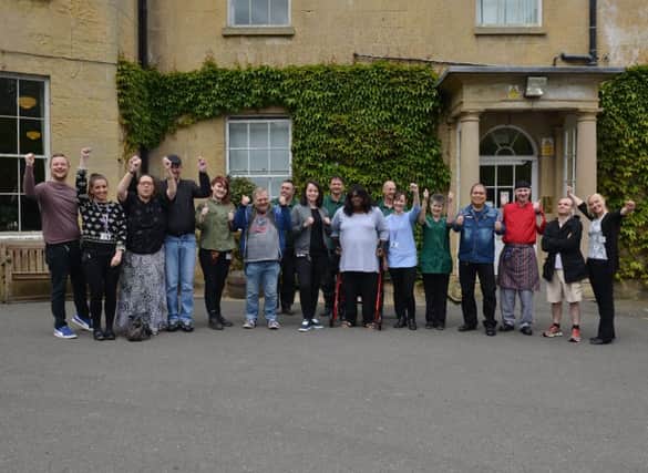 Thistle Hill Hall care home has been rated as outstanding in all five areas after a CQC inspection. Pictured are staff and residents
