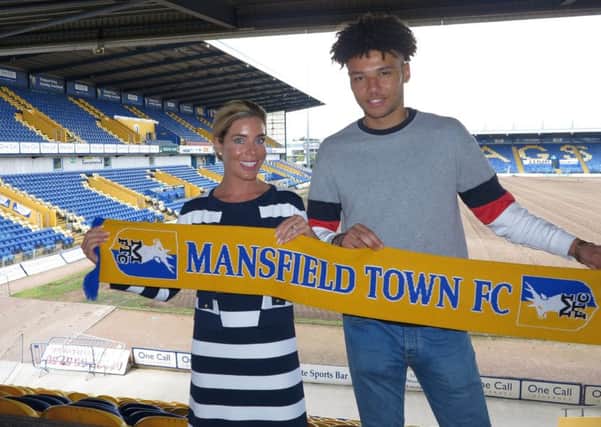 Stags CEO Carolyn Radford welcomes Lee Angol to the club .