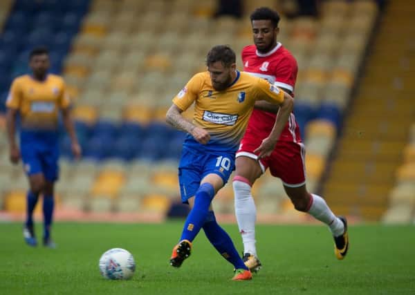 Mansfield Town vs Middlesborough - Paul Anderson sends the ball forward - Pic By James Williamson