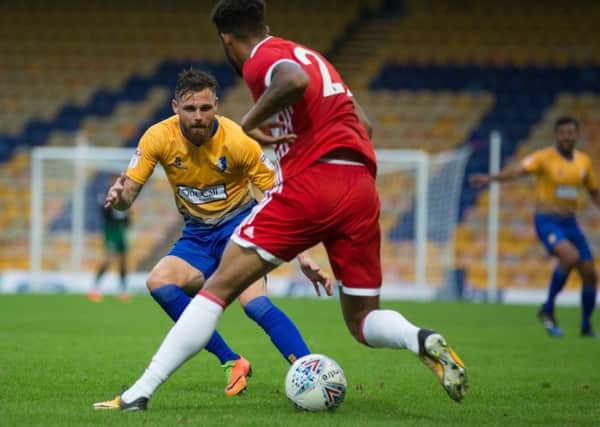 Mansfield Town vs Middlesborough - Paul Anderson looks to win back possession - Pic By James Williamson