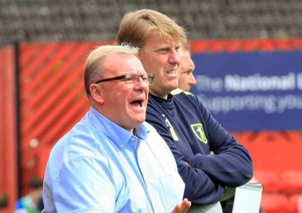 Steve Evans with Paul Raynor. Picture: Chris Etchells