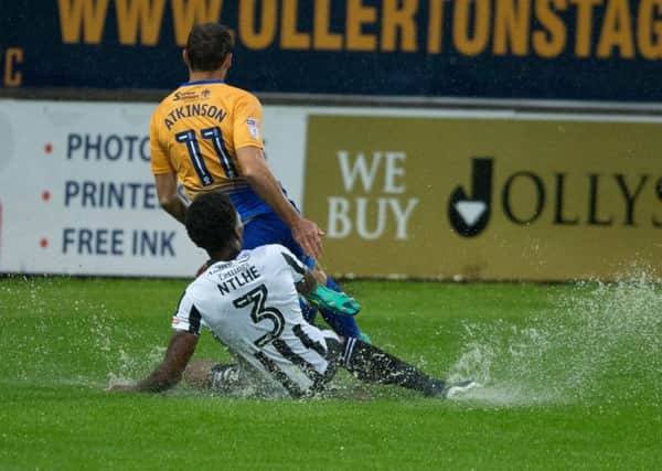 Mansfield Town vs Rochdale - Heavy rain made for a saturated surface - Pic By James Williamson