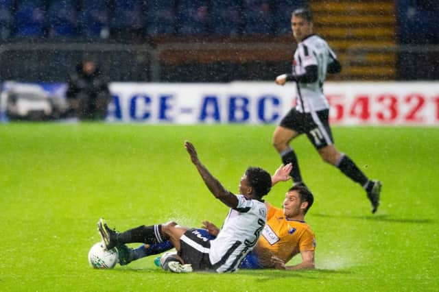 Mansfield Town vs Rochdale - Will Atkinson of Mansfield Town goes in for a 50/50 tackle - Pic By James Williamson