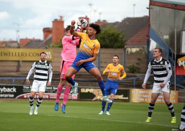 Lee Angol challenges Bradley Collins during Mansfield Town v Forest Green, United Kingdom, 12 August 2017. Photo by Glenn Ashley.