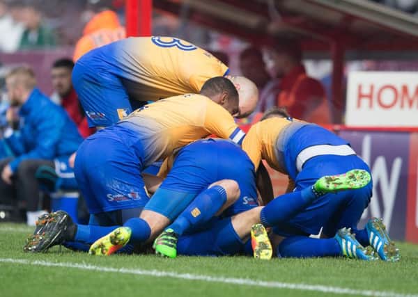 Lincoln City v Mansfield Town - Danny Rose of Mansfield Town is mobbed after his goal - Pic By James Williamson